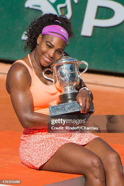 Serena Williams of the United States poses with the Coupe Suzanne Lenglen trophy after winning the Women's Singles Final against Lucie Safarova of...