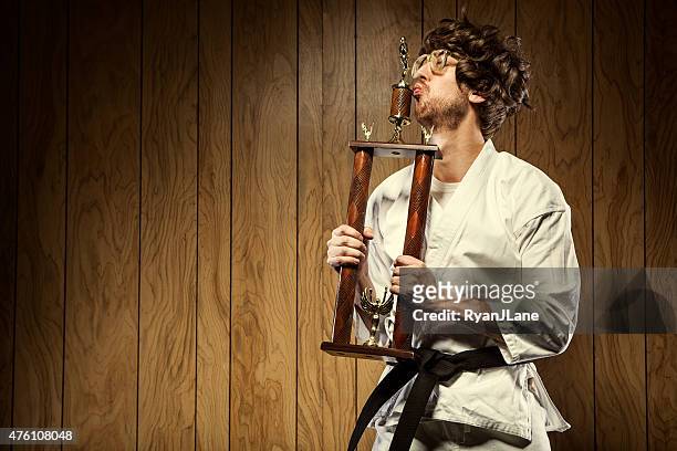 karate nerd is proud of his trophy - comedy honors awards show stock pictures, royalty-free photos & images