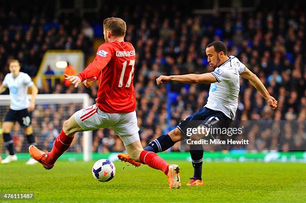 Aron Gunnarsson of Cardiff City tries to block a shot from Andros Townsend of Tottenham Hotspur during the Barclays Premier League match between...