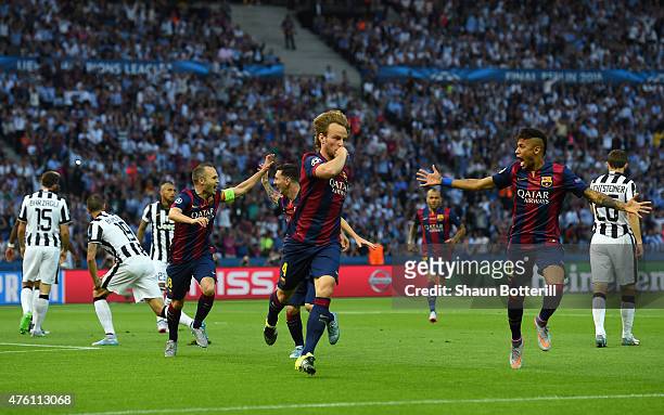 Ivan Rakitic of Barcelona celebrates scoring the opening goal with Neymar during the UEFA Champions League Final between Juventus and FC Barcelona at...