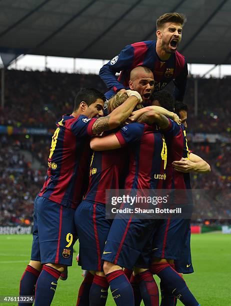 Gerard Pique of Barcelona celebrates with team mates after the goal scored by Ivan Rakitic during the UEFA Champions League Final between Juventus...