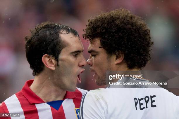 Diego Godin of Atletico de Madrid faces with Pepe of Real Madrid CF during the La Liga match between Club Atletico de Madrid and Real Madrid CF at...