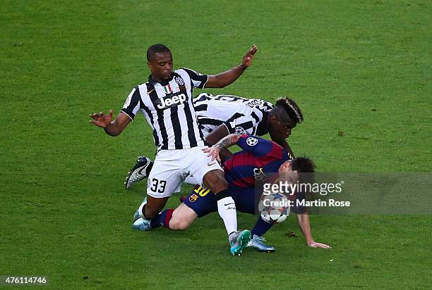 Lionel Messi of Barcelona is tackled by Patrice Evra and Paul Pogba of Juventus during the UEFA Champions League Final between Juventus and FC...