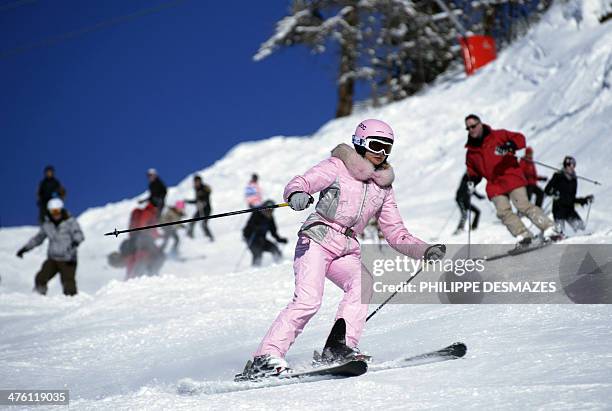 Skier all dressed in pink rides down a slope at the ski resort of Val-d'Isere, in the French Alps, on March 2 during France's school holidays. AFP...