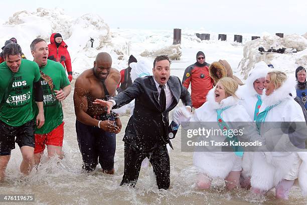 Israel Idonije and Jimmy Fallon participates in the Chicago Polar Plunge 2014 at North Avenue Beach on March 2, 2014 in Chicago, Illinois.