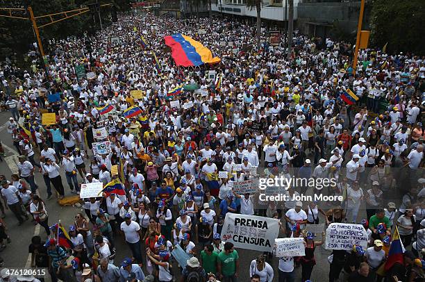 Protester carries a sign decrying press cencorship as thousands of protesters march in a massive anti-government demonstration on March 2, 2014 in...