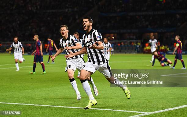 Alvaro Morata of Juventus celebrates scoring his team's first goal with Stephan Lichtsteiner during the UEFA Champions League Final between Juventus...