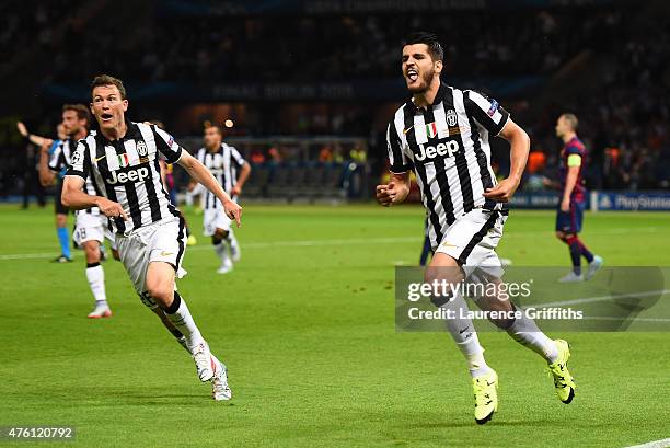 Alvaro Morata of Juventus celebrates scoring his team's first goal with Stephan Lichtsteiner during the UEFA Champions League Final between Juventus...