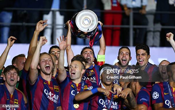 Xavi Hernandez of Barcelona lifts the trophy as he celebrates victory with team mates after the UEFA Champions League Final between Juventus and FC...