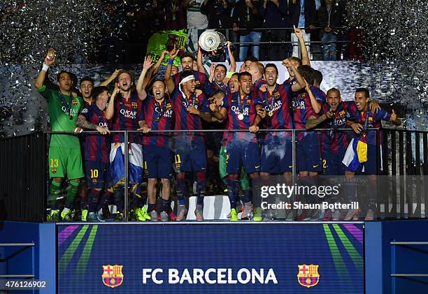 Xavi Hernandez of Barcelona lifts the trophy as he celebrates victory with team mates after the UEFA Champions League Final between Juventus and FC...