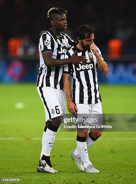 Andrea Pirlo of Juventus is consoled by Paul Pogba after the UEFA Champions League Final between Juventus and FC Barcelona at Olympiastadion on June...