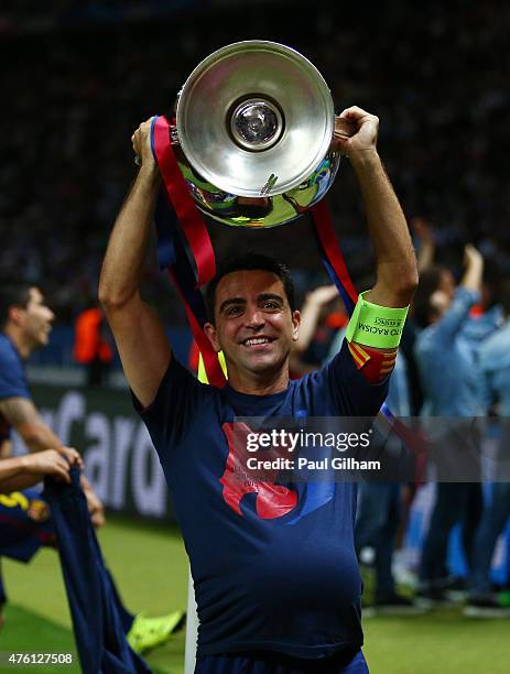 Xavi Hernandez of Barcelona lifts the trophy as he celebrates victory after the UEFA Champions League Final between Juventus and FC Barcelona at...