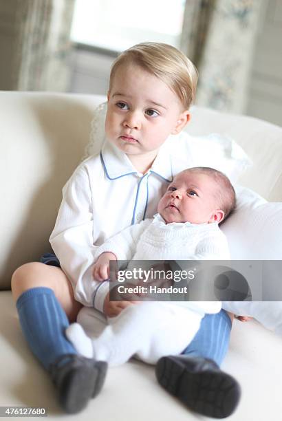 In this undated handout image released by the Duke and Duchess of Cambridge, Prince George and Princess Charlotte at Anmer Hall in mid-May in...