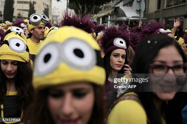 Participants take part in the Carnival of the Cypriot port city of Limassol on March 2, 2014. AFP PHOTO / YIANNIS KOURTOGLOU