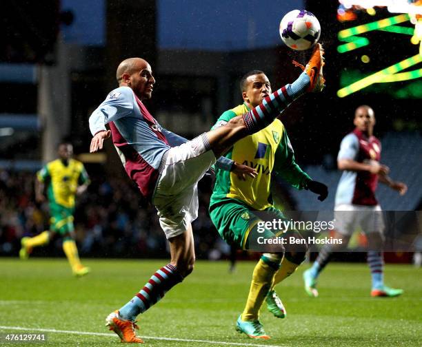 Karim El Ahmadi of Aston Villa controls the ball ahead of Martin Olsson of Norwich during the Barclays Premier League match between Aston Villa and...