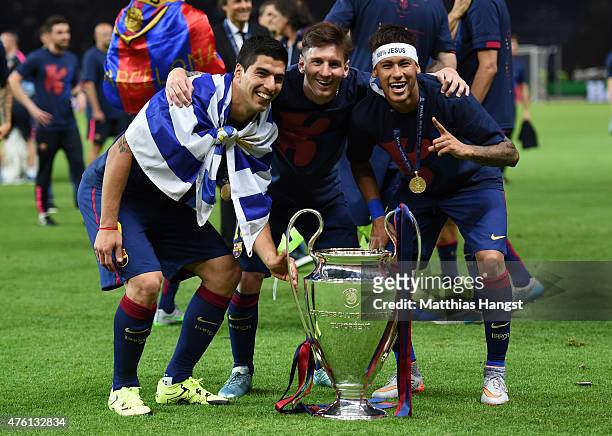 Luis Suarez, Lionel Messi and Neymar of Barcelona celebrate with the trophy after the UEFA Champions League Final between Juventus and FC Barcelona...