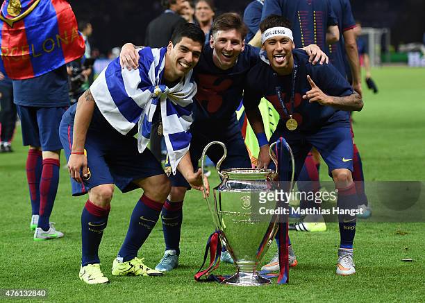 Luis Suarez, Lionel Messi and Neymar of Barcelona celebrate with the trophy after the UEFA Champions League Final between Juventus and FC Barcelona...