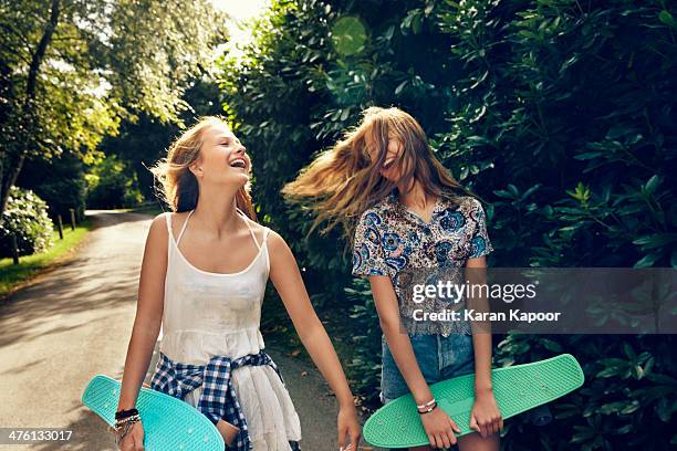 teenage girls laughing - skateboard park imagens e fotografias de stock