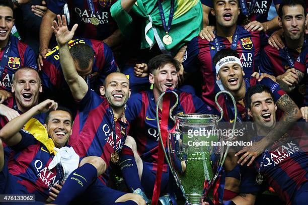Lionel Messi of Barcelona celebrates with his team and the trophy during the UEFA Champions League Final between Barcelona and Juventus at...