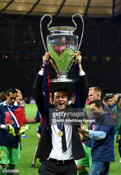 Luis Enrique manager of Barcelona celebrates victory with the trophy after the UEFA Champions League Final between Juventus and FC Barcelona at...