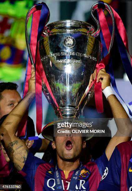 Barcelona's midfielder Rafinha holds up the tropphy after the UEFA Champions League Final football match between Juventus and FC Barcelona at the...