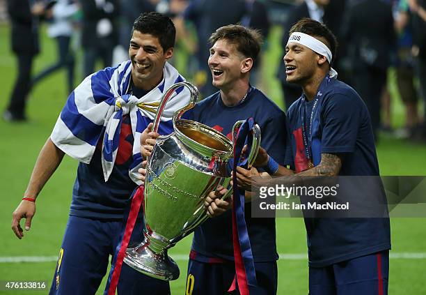 Luis Suarez, Lionel Messi and Neymar, all of Barcelona celebrate the trophy during the UEFA Champions League Final between Barcelona and Juventus at...