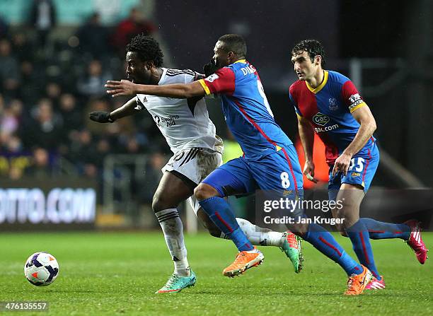 Wilfried Bony of Swansea City holds off Kagisho Dikgacoi of Crystal Palace during the Barclays Premier League match between Swansea City and Crystal...
