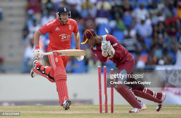 Tim Bresnan of England is run out by West Indies wicketkeeper Denesh Ramdin during the 2nd One Day International between the West Indies and England...