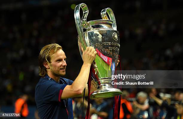 Ivan Rakitic of Barcelona holds the trophy as he celebrates victory after the UEFA Champions League Final between Juventus and FC Barcelona at...