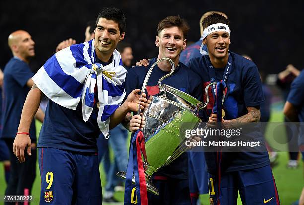 Luis Suarez, Lionel Messi and Neymar of Barcelona celebrate with the trophy after the UEFA Champions League Final between Juventus and FC Barcelona...