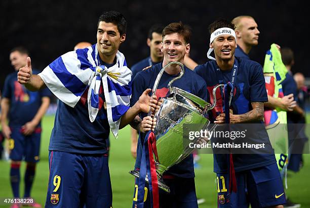 Luis Suarez, Lionel Messi and Neymar of Barcelona celebrate with the trophy after the UEFA Champions League Final between Juventus and FC Barcelona...