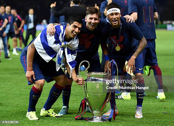 Luis Suarez, Lionel Messi and Neymar of Barcelona celebrate with the trophy after the UEFA Champions League Final between Juventus and FC Barcelona...