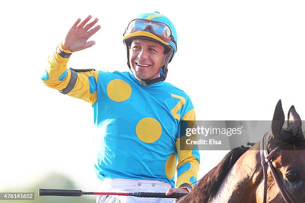 Victor Espinoza, celebrates atop American Pharoah, in the winner's circle after winning the 147th running of the Belmont Stakes at Belmont Park on...