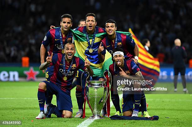 Douglas, Daniel Alves, Adriano; Rafinha and Neymar of Barcelona celebrate with the trophy after the UEFA Champions League Final between Juventus and...