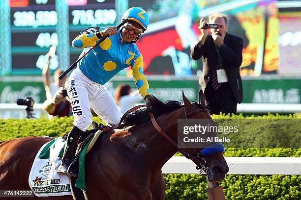 Victor Espinoza, celebrates atop American Pharoah, after winning the 147th running of the Belmont Stakes at Belmont Park on June 6, 2015 in Elmont,...
