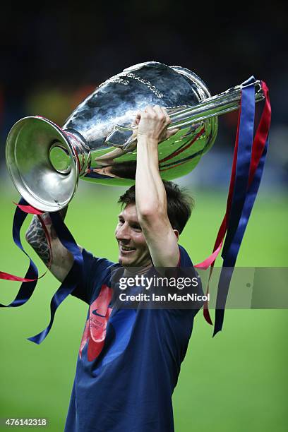 Lionel Messi of Barcelona lifts the trophy during the UEFA Champions League Final between Barcelona and Juventus at Olympiastadion on June 6, 2015 in...