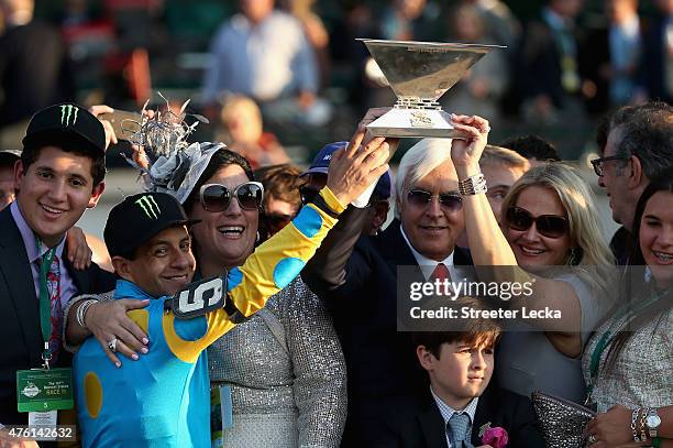 Victor Espinoza , jockey of American Pharaoh, and trainer Bob Baffert, celebrate with the Triple Crown Trophy after winning the 147th running of the...