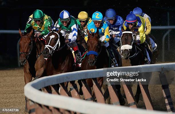 American Pharoah, ridden by Victor Espinoza, leads the pack during the 147th running of the Belmont Stakes at Belmont Park on June 6, 2015 in Elmont,...