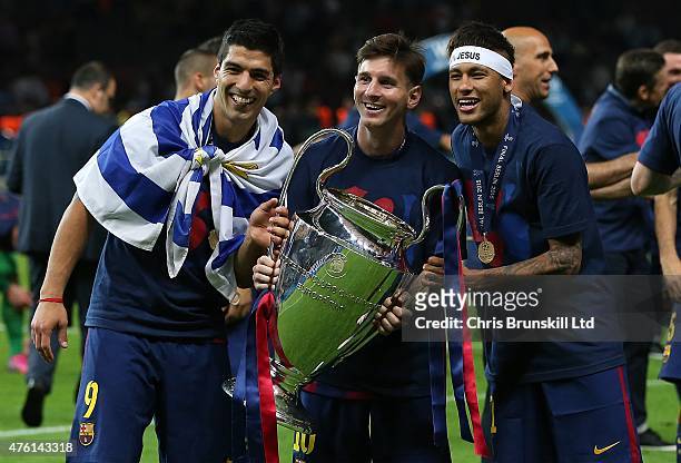 Luis Suarez, Lionel Messi and Neymar of FC Barcelona celebrate with the trophy following the UEFA Champions League Final match between Juventus and...