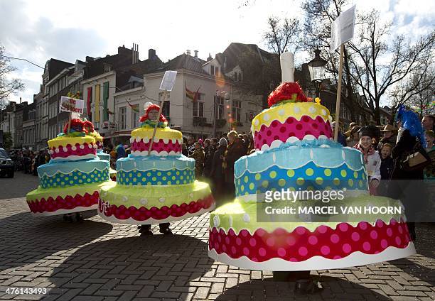 Party-goers dressed like cakes parade during the traditional Carnaval parade in the centre of Maastricht on March 2, 2014. AFP PHOTO/ANP MARCEL VAN...