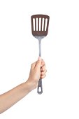 Woman hand holding a spatula