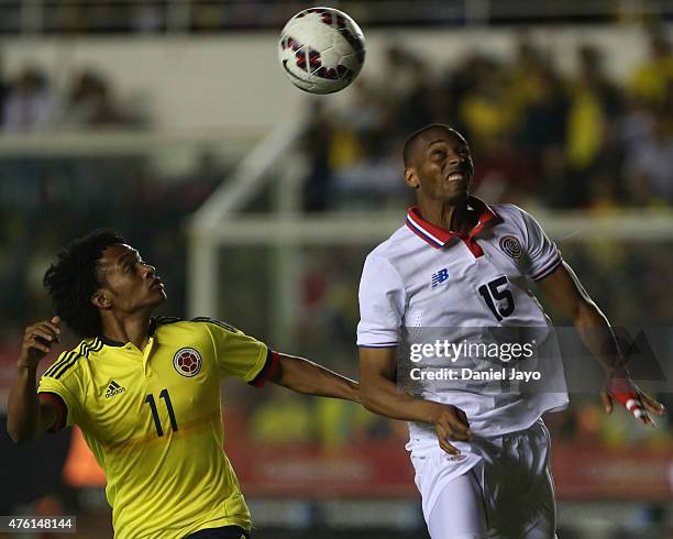 Juan Cuadrado of Colombia and Junior Diaz of Costa Rica go for a header during a friendly match between Colombia and Costa Rica at Diego Armando...