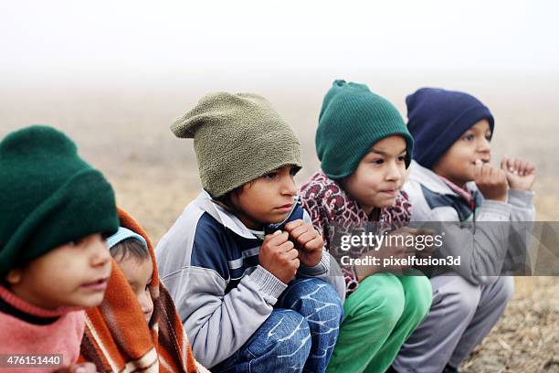 shivering children in winter season - sweater shivering stock pictures, royalty-free photos & images