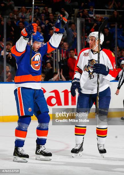 Thomas Vanek of the New York Islanders celebrates his second goal of the first period goal as Tomas Fleischmann of the Florida Panthers looks on at...