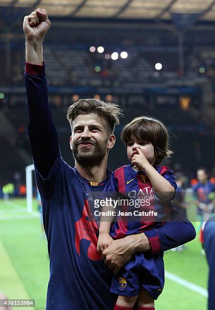Gerard Pique of Barcelona and his son Milan Pique Mebarak celebrate the victory after the UEFA Champions League Final between Juventus Turin and FC...