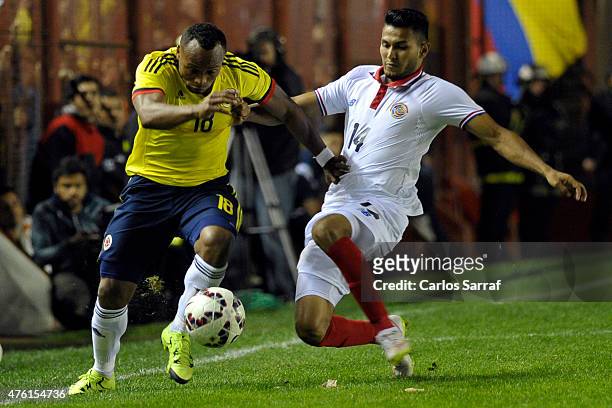 Camilo Zu?iga of Colombia fights for the ball with Deyver Vega of Costa Rica during a friendly match between Colombia and Costa Rica at Diego Armando...