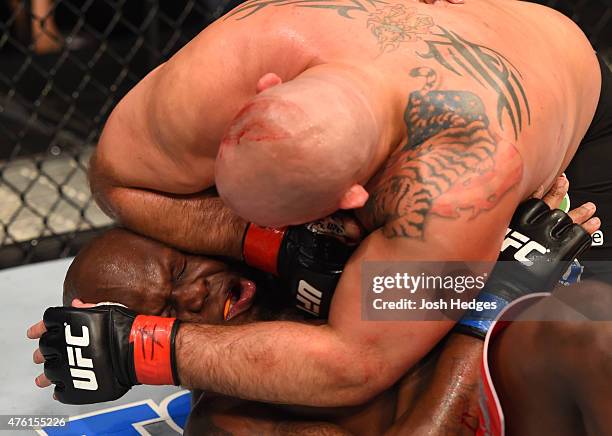 Shawn Jordan elbows Derrick Lewis in their heavyweight bout during the UFC event at the Smoothie King Center on June 6, 2015 in New Orleans,...