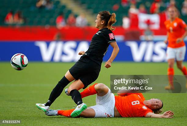 Sherida Spitse of Netherlands makes a play on the ball against Ali Riley of New Zealand during the FIFA Women's World Cup Canada 2015 Group A match...