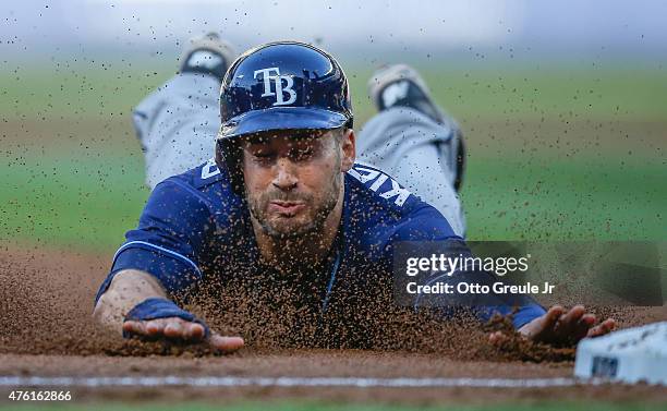 Kevin Kiermaier of the Tampa Bay Rays steals third base in the first inning against the Seattle Mariners at Safeco Field on June 6, 2015 in Seattle,...