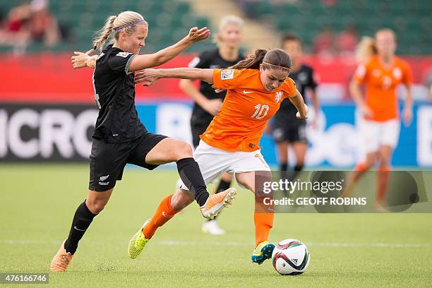 New Zealand's Katie Duncan vies for the ball with the Netherlands' Danielle Van De Donk during their Group A football match at Commonwealth Stadium...